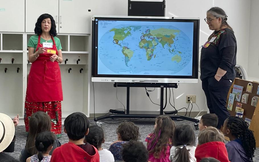 Fourth-grade teachers Rosemarie Martin, left, and Delia Cruz speak about Hispanic cultures and traditions at John O. Arnn Elementary School near Camp Zama, Japan, on Feb. 15, 2024. 