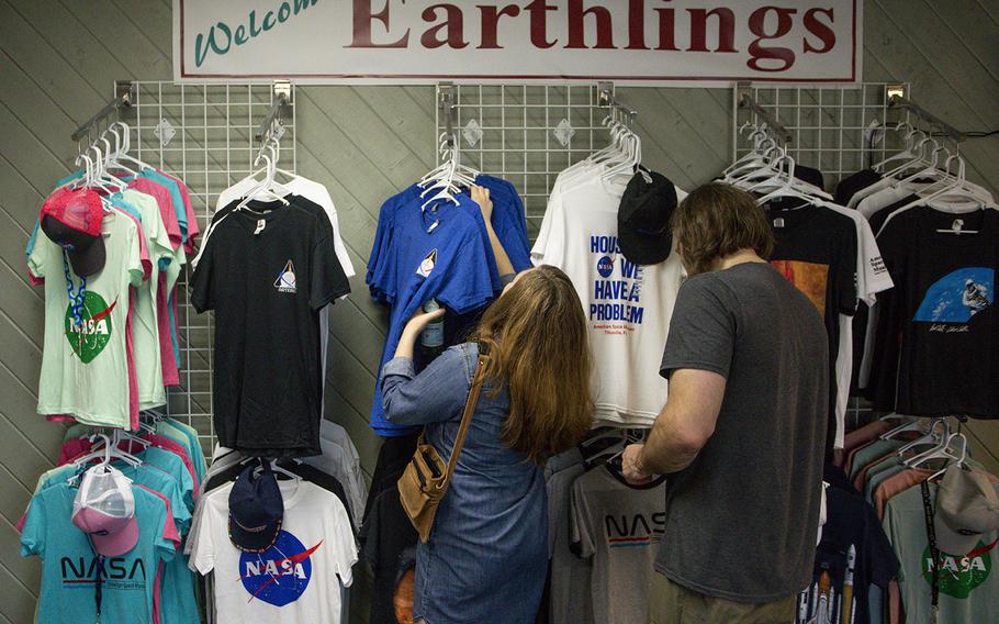 Mary Kathleen Bryan, 45, and Robert Streicho, 42, of Nashville, shop for souvenirs after visiting the American Space Museum in Titusville in August 2022.