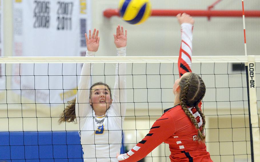 E.J. King's Madylyn O'Neill spikes against Yokota's Lilly Wellons during Friday's DODEA-Japan volleyball match. The Cobras won in three sets.
