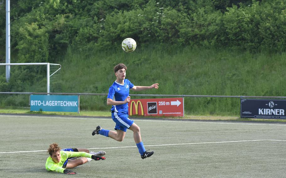 Marymount's Piergiorgio Durola thinks he has a goal after getting himself and the ball past Rota goalkeeper Christian Weaver. But he was called offsides on Monday, May 15, 2023, in the first round of the DODEA-Europe Division II soccer championships in Baumholder, Germany.