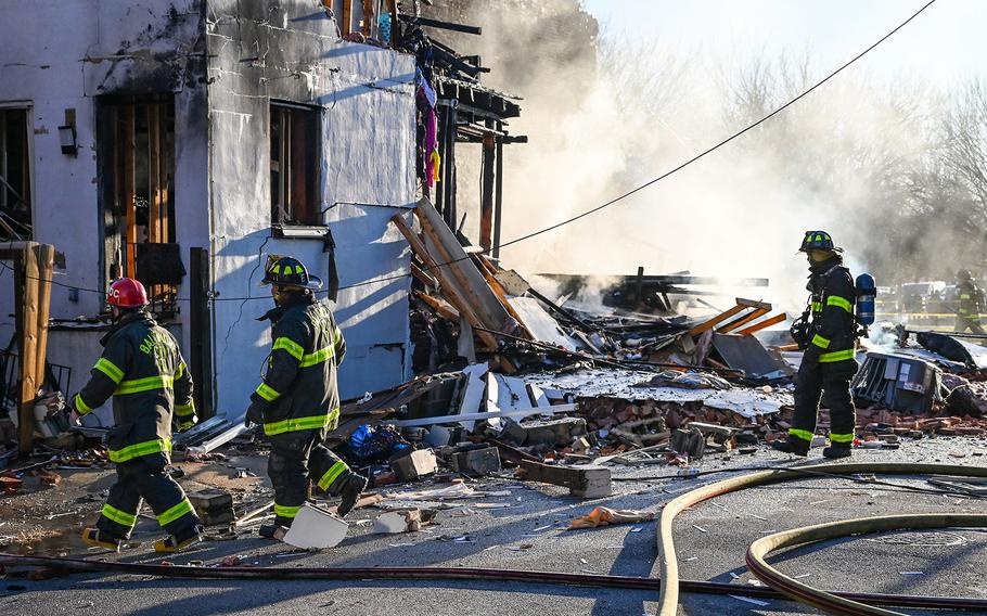 Baltimore firefighters work at the scene of an explosion in Pigtown in the 1100 block of Bayard Street on Tuesday, Nov. 22, 2022.