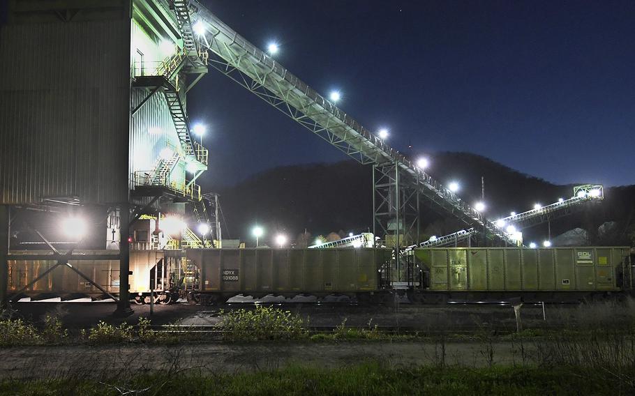 Coal cars wait in line to be loaded at the tipple at a coal loading facility in Belle, W.Va. 