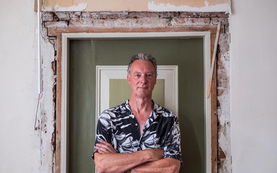 More than 26,000 homes in the northern Dutch province of Groningen have been severely damaged by earthquakes triggered by drilling for natural gas. Ger Warink stands in a doorway of his house in Loppersum. He has been living across the street while his home is repaired.