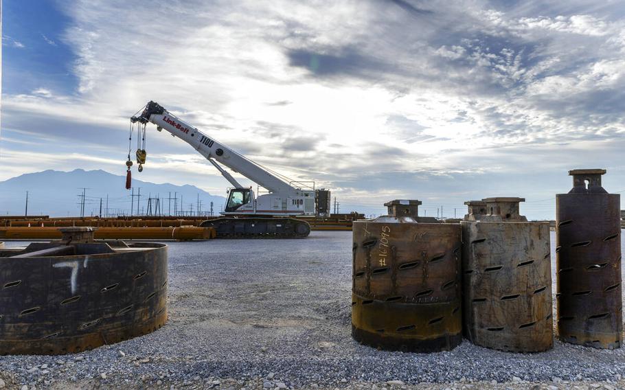 A crane in the background at an energy site.
