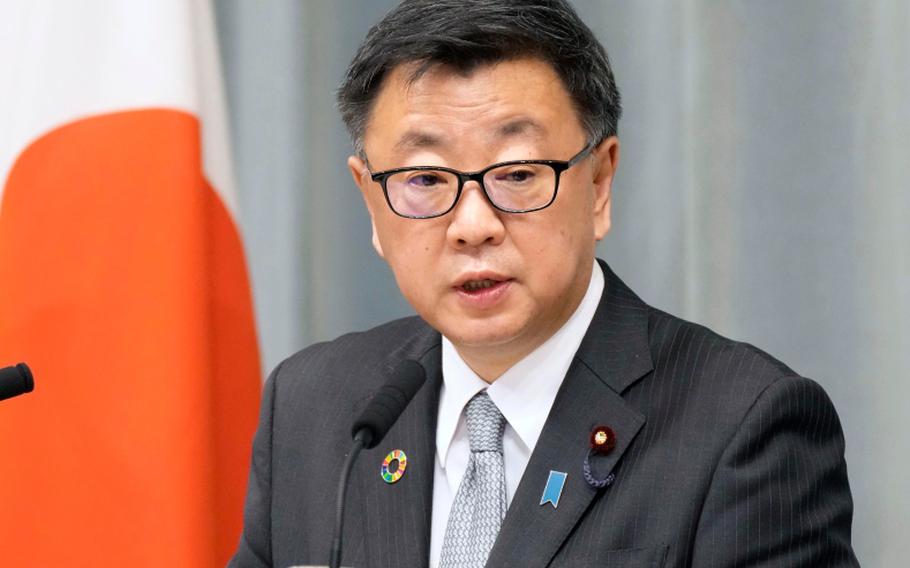 Japan’s Chief Cabinet Secretary Hirokazu Matsuno speaks on Friday, Dec. 24, 2021, in  Tokyo, where he announced that Japan won’t send a delegation of ministers to represent the government at the Beijing Games.