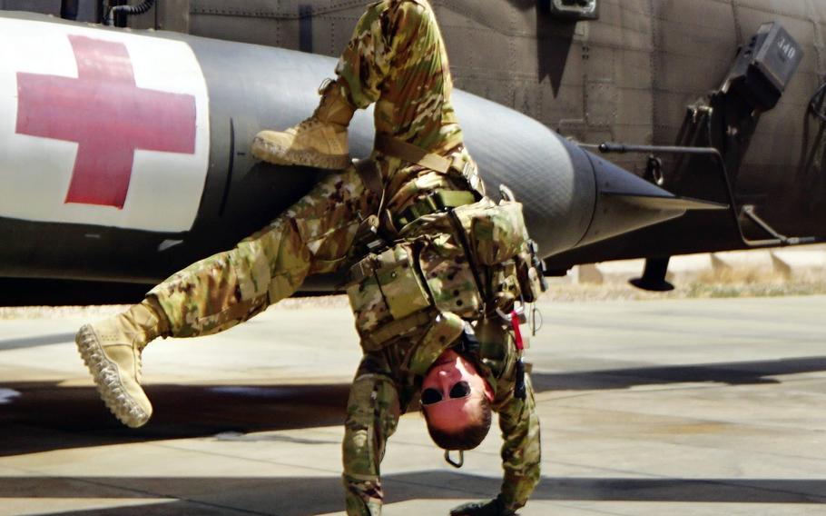 Staff Sgt. Brianna Pritchard, an Army National Guard UH-60 Black Hawk helicopter mechanic from Anchorage, Alaska, demonstrates her breaking moves at al Asad Air Base, Iraq. 