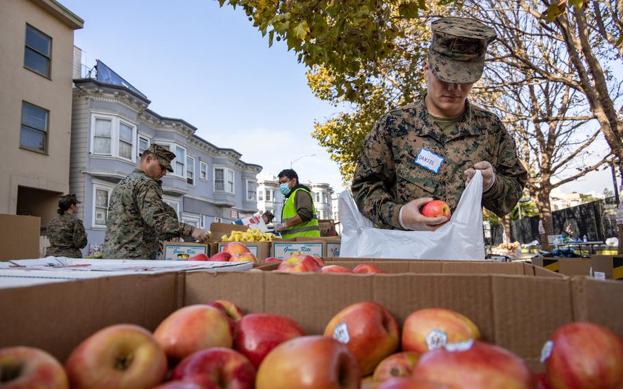 U.S. Marines and sailors participate in a food bank donation in San Francisco on Oct. 6, 2022. A recent study found that more than 25% of active-duty service members experience food insecurity.
