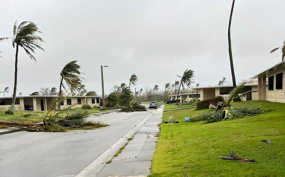Fallen trees and debris litter a residential area at Andersen Air Force Base, Guam, Thursday, May 25, 2023, as Typhoon Mawar moves away from the island.
