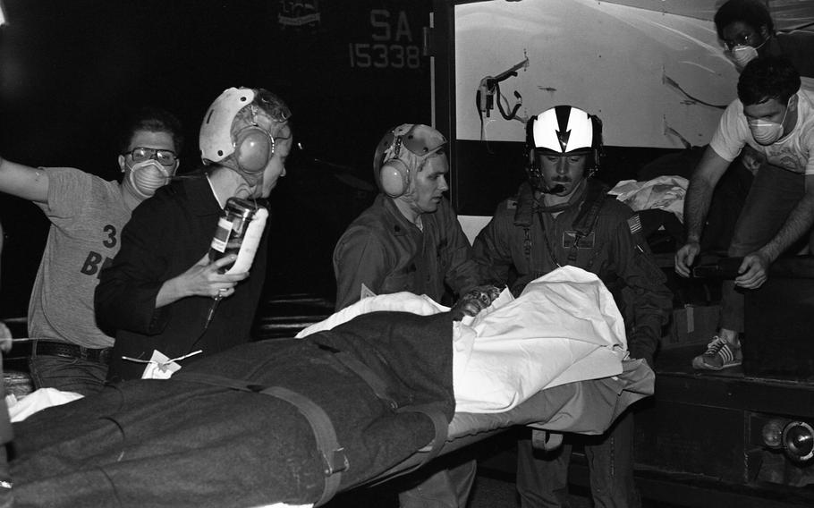 A burn victim on a stretcher.