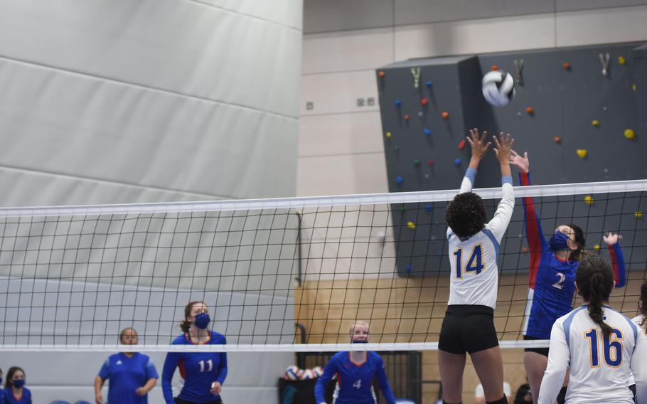 Alynna Palacios of Wiesbaden and Ramstein senior Kay Golden battle for the ball in the semifinal round of the DODEA-Europe Division I girls’ volleyball championships on Saturday, Oct. 30, 2021, at the Ramstein High School gym in Germany. Wiesbaden beat Ramstein in two sets to play in the finals, where the Warriors lost to Stuttgart