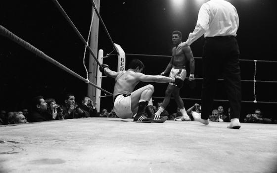 European champion Karl Mildenberger of Germany is down after a crisp left hook to the jaw from defending world heavyweight champion Muhammad Ali. The drop came in the eighth round of a scheduled 15-round title bout in Frankfurt, Germany on Sept. 10, 1966. Ali won a technical knockout when the referee Teddy Waltham stopped in the 12th to protect the bleeding German from more punishment.[cg]