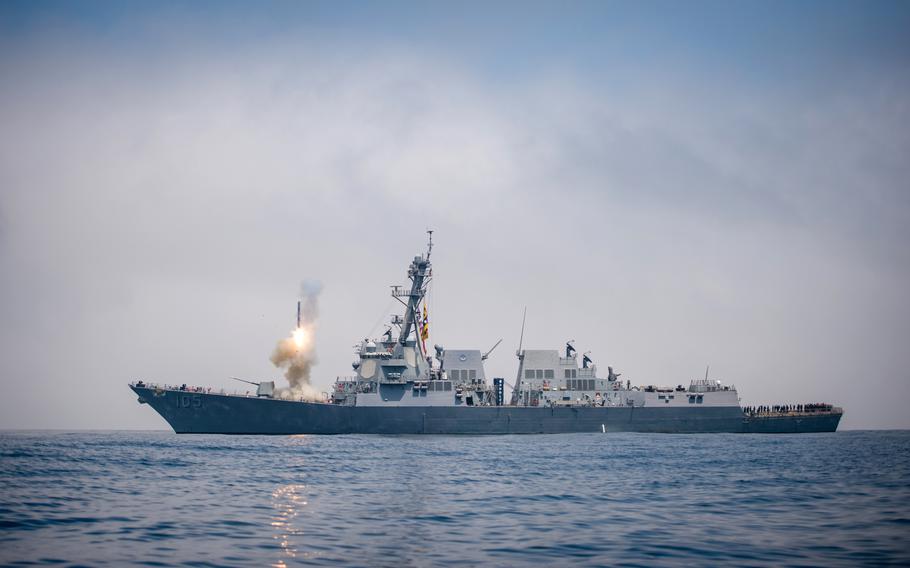 The guided missile destroyer USS Dewey conducts a Tomahawk missile flight test while underway in the western Pacific, Aug. 17, 2018.