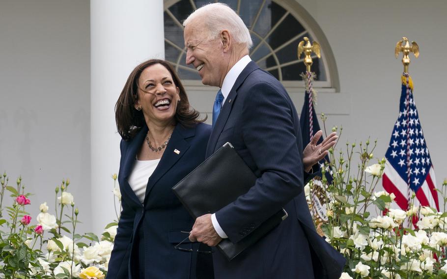 Vice President Kamala Harris and President Joe Biden smile and walk off after speaking about updated guidance on mask mandates, in the Rose Garden of the White House, Thursday, May 13, 2021, in Washington. 