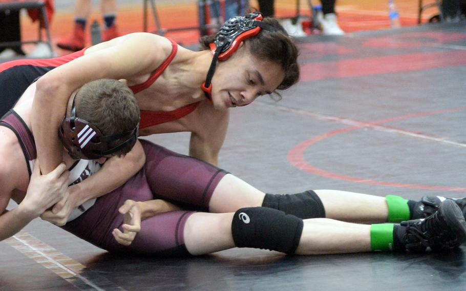 E.J. King's Andre Pyryt gains the edge on Matthew C. Perry's Jacob Morton during Saturday's DODEA-Japan wrestling dual meet. Pyryt won by pin in 54 seconds, but the Samurai won the meet 27-25.