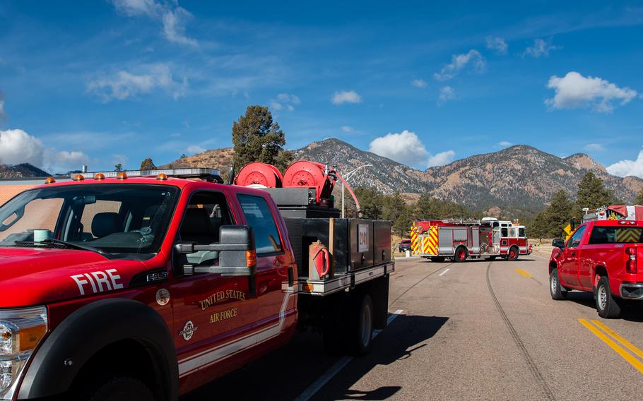 Firefighters from the U.S. Air Force Academy, Fort Carson and the Colorado Springs Fire Department dump water from air assets in their fight against the West Monument Creek Fire on the U.S. Air Force Academy on Monday, Feb. 26, 2024.