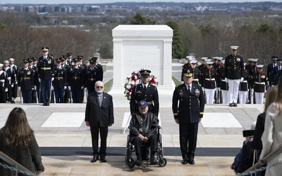 A Medal of Honor recipient in a wheelchair faces a crowd of people