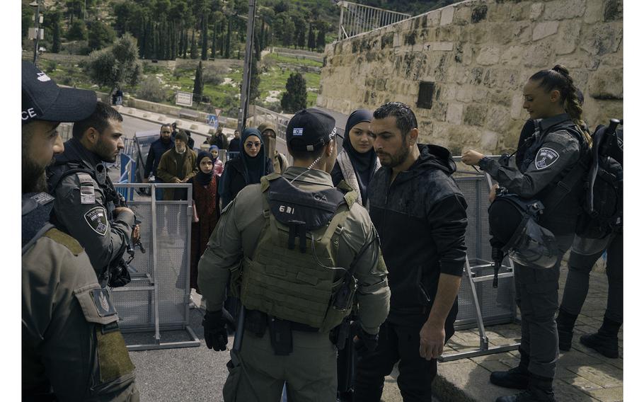 Israeli police check the identification documents of Palestinians seeking to pray at al-Aqsa Mosque on March 15, 2024.