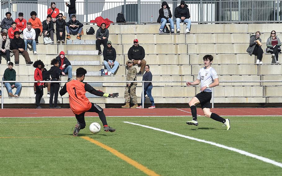 Stuttgart midfielder Christian Groves watches his shot go past Raider goalkeeper Sean Gooden for a goal during a boys soccer match on March 9, 2024, at Kaiserslautern High School in Kaiserslautern, Germany.