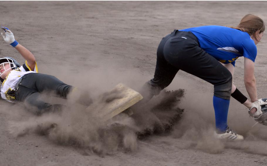 Kadena's Julia Petruff slides into third base safely ahead of the throw to Yokota's Kayla Bogdan.