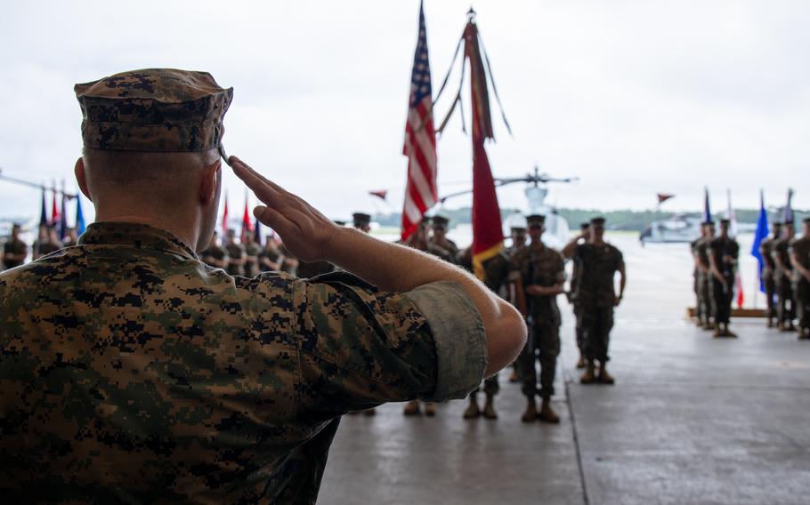 U.S. Marine Corps Lt. Col. Jens Gilbertson, from Washington, commanding officer of Marine Light Attack Helicopter Squadron (HMLA) 269, salutes during the reactivation ceremony of Marine Light Attack Helicopter Squadron (HMLA) 269 at Marine Corps Air Station New River, North Carolina,.