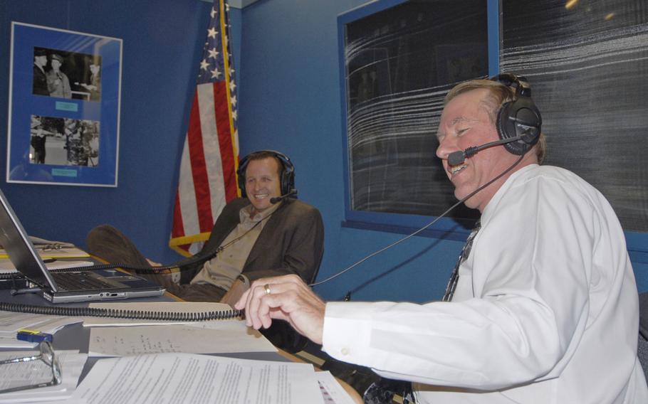 Larry Sichter, foreground, American Forces Network affiliate relations chief, and Jef Reilly, American Forces Radio director, answer questions from callers in 2009 at AFN Europe's studio headquarters in Mannheim, Germany. Callers asked about the preponderance of sports programming and questioned why AFN radio aired controversial political commentator Rush Limbaugh.