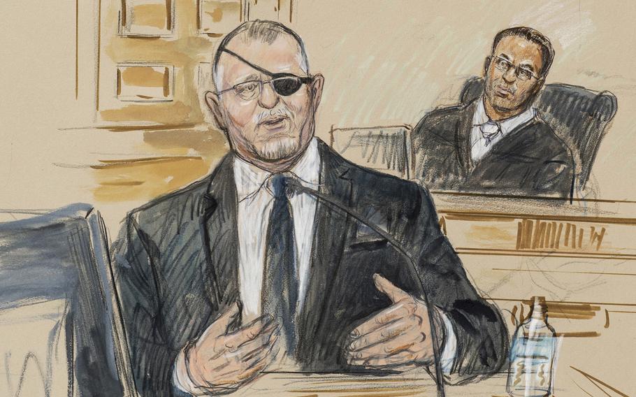 This artist sketch depicts the trial of Oath Keepers leader Stewart Rhodes, left, as he testifies before U.S. District Judge Amit Mehta on charges of seditious conspiracy in the Jan. 6, 2021, attack on the U.S. Capitol, in Washington, Nov. 7, 2022. 