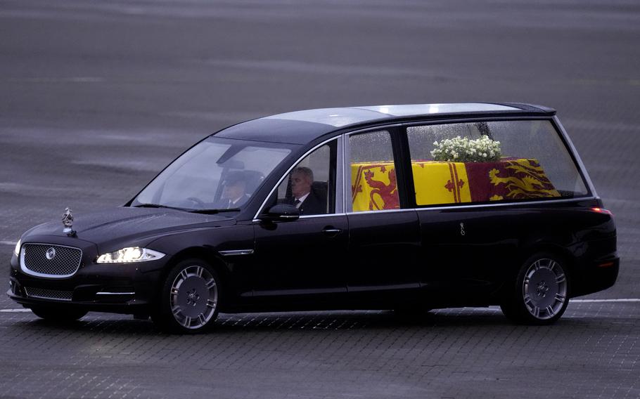 The State Hearse carrying the coffin of Queen Elizabeth II at RAF Northolt in London, to be taken to Buckingham Palace, Tuesday, Sept. 13, 2022.