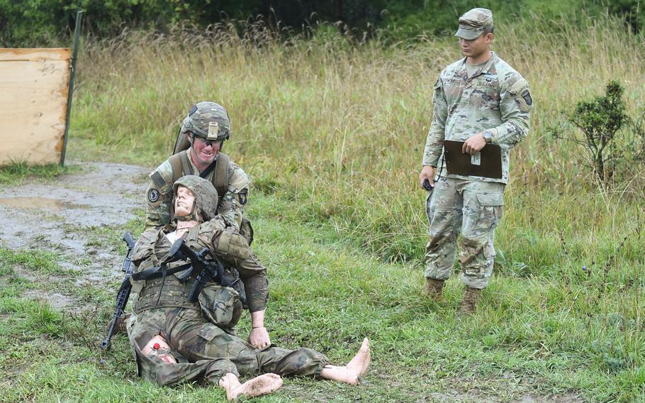 A soldier with the 2nd Cavalry Regiment drags a simulated casualty as part of the Expert infantryman Badge testing on Sept. 14, 2022 at the Vilseck training area. The soldiers were on display as the African Land Forces Colloquium took a tour of the testing and training at the range. 