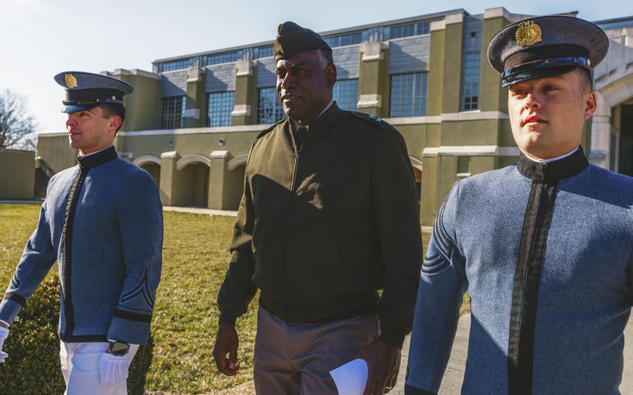 Retired Maj. Gen. Cedric T. Wins, center, Virginia Military Institute's first Black superintendent, walks with cadets Ethan Miles, left, and Reece Demory after speaking to potential students and families during an open house event. 