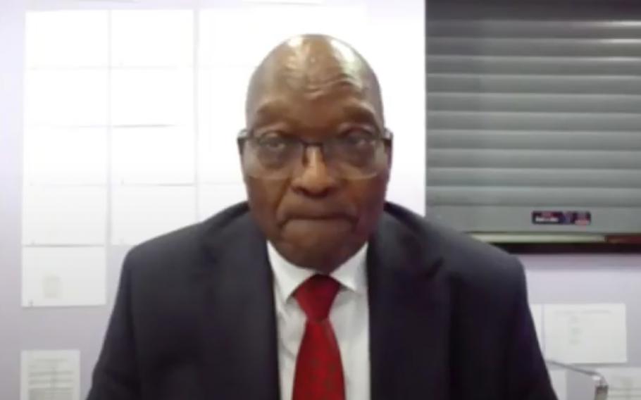 In this frame grab, former South Africa President Jacob Zuma appears on a screen virtually from the correctional service facility Estcourt, in Pietermaritzburg, South Africa, Monday July 19, 2021, where his corruption trial resumes.