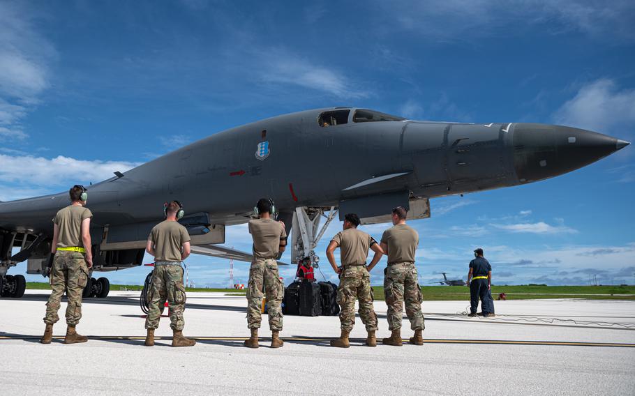 Airmen assigned to the 28th Bomb Wing receive a B-1B bomber assigned to the 37th Expeditionary Bomb Squadron, Ellsworth Air Force Base, S.D., after landing at Andersen Air Force Base, Guam, Oct. 18, 2022. 