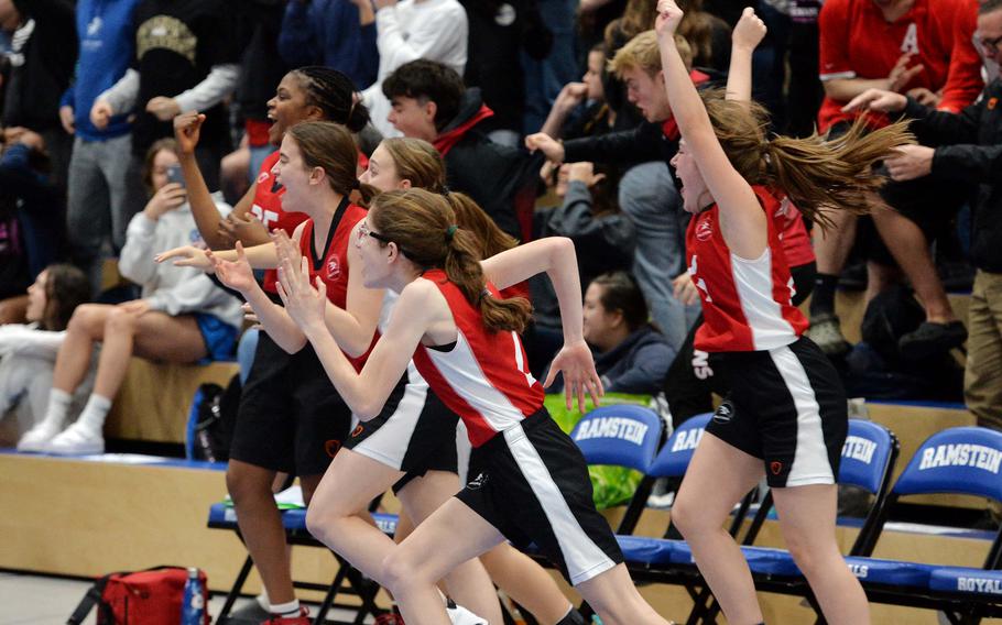 AOSR players rush the court to celebrate the Falcons 26-25 win over Naples in the Division II championship game at the DODEA-Europe basketball finals in Ramstein, Germany, Feb. 18, 2023.