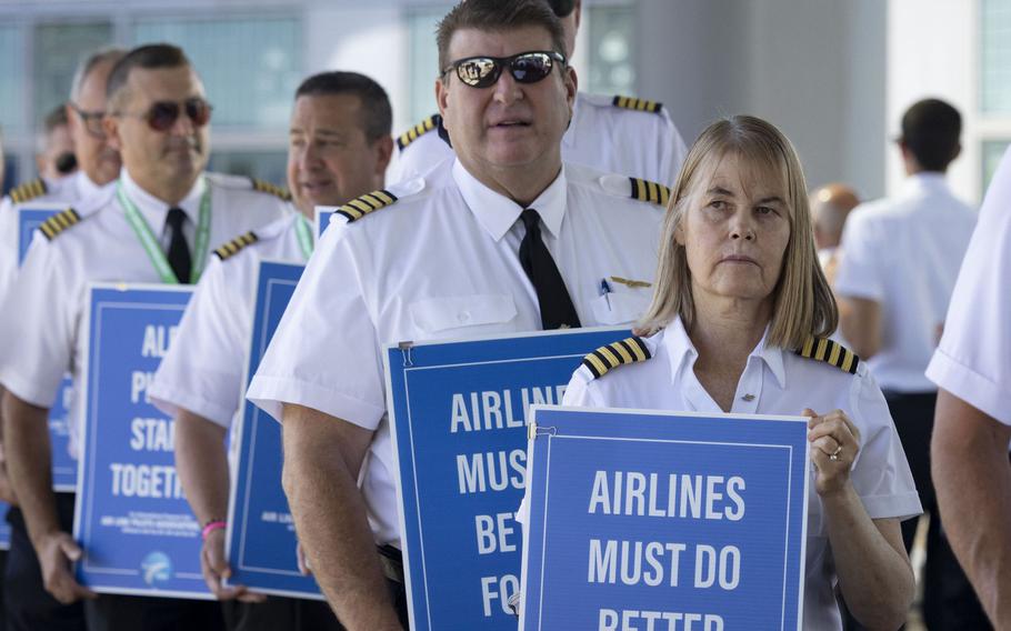 Airline pilots with ALPA National picket outside O’Hare International Airport in support of improved working conditions and benefits across their profession Sept. 1, 2022, in Chicago. 