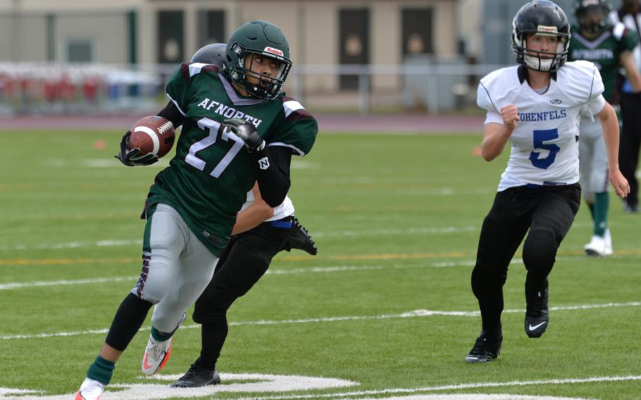 AFNORTH’s Marques Williams gets away from the Hohenfels defense on his way to a big gain in the Lions’ 76-28 win over the Tigers in a Division III game played at Kaiserslautern High School, Saturday, Sept. 11, 2021.