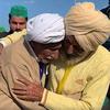 A video screen grab shows Sikka Khan, right, hugging his older brother Sadiq. The two were separated during India’s war of partition in 1947 and reunited after 74 years. 