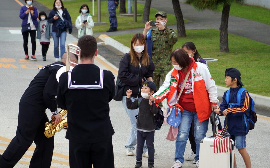 Members of the 7th Fleet Band welcome visitors to Spring Festival at Naval Air Facility Atsugi, Japan, April 22, 2023.
