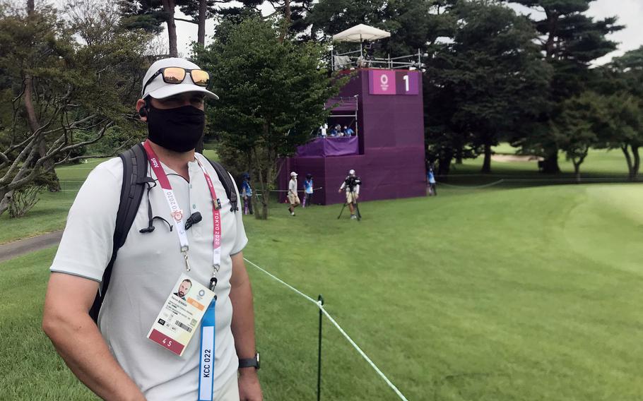 Patrick Bowman, the golf professional at the Air Force-run Tama Hills Golf Course, helps run the Olympic golf competition at Kasumigaseki Country Club in Saitama prefecture, Japan, Thursday, July 29, 2021. 