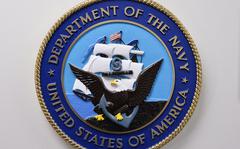 This photo reviewed by the US military shows the United States Department of the Navy emblem hanging on a wall at the Joint Detention Forces Headquarters at Guantanamo Bay US Naval Base, Cuba, April 09, 2014. 