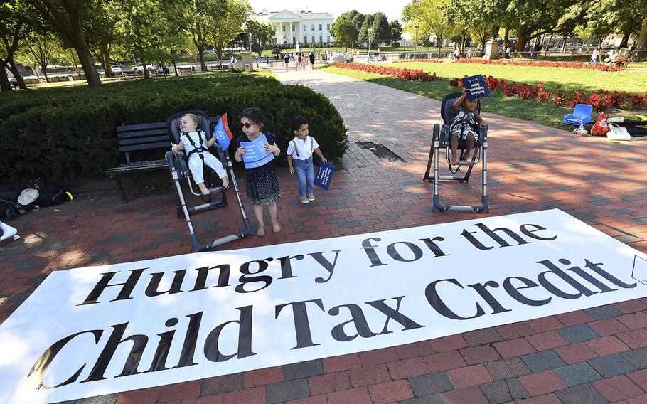 Parents and caregivers with the Economic Security Project gather outside the White House to advocate for the Child Tax Credit in advance of the White House Conference on Hunger, Nutrition, and Health on September 20, 2022, in Washington, DC. 