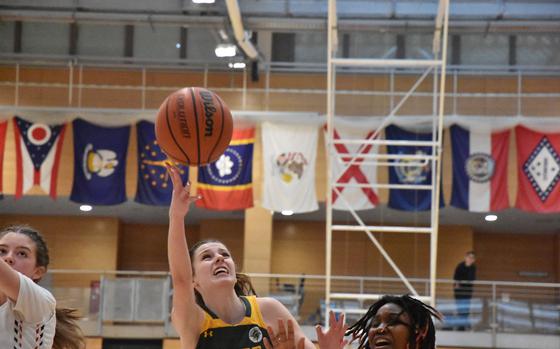 Lakenheath's Jessie Moon puts up a shot in her team's victory over Kaiserslautern at the DODEA European Division I Basketball Championships on Thursday, Feb. 15, 2024, in Wiesbaden, Germany.

Kent Harris/Stars and Stripes