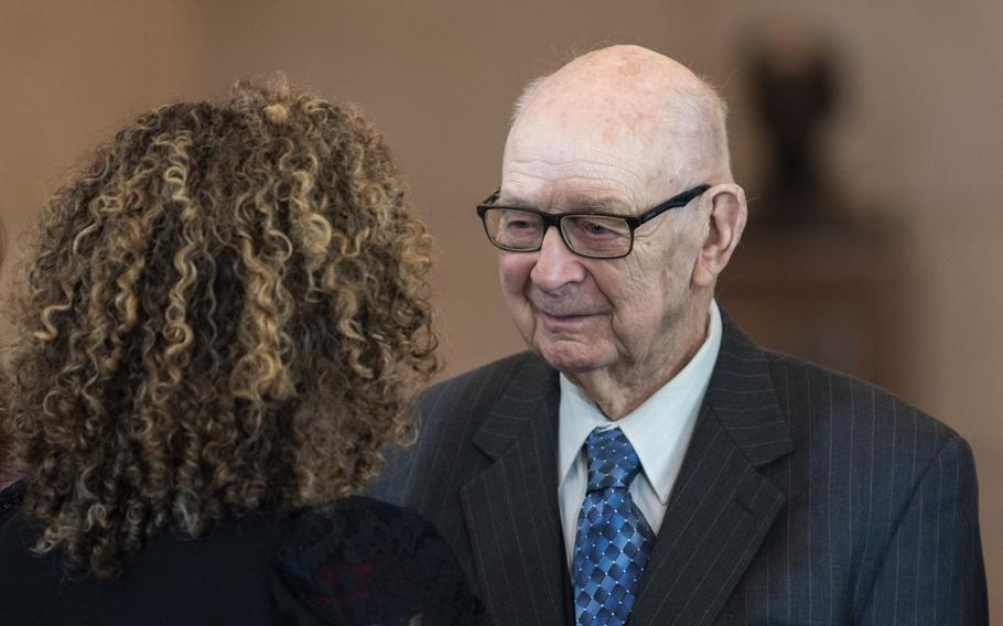 John Christman speaks with a well-wisher after he and fellow members of the World War II Ghost Army were awarded the Congressional Gold Medal at the U.S. Capitol in Washington, D.C., on March 21, 2024.