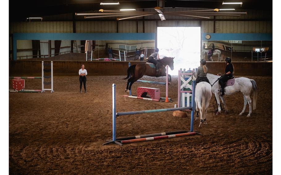 Ellen Doughty coaches during a group lesson at Rockwall Hills.