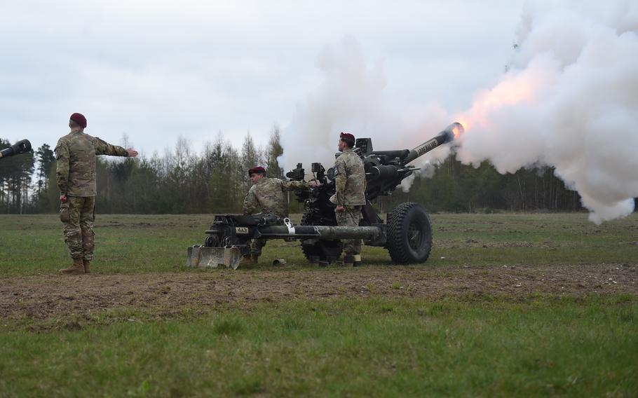 A six-round cannon salute is rendered by members of the 319th Airborne Field Artillery Regiment during a drop zone dedication ceremony at Grafenwoehr, Germany, on April 20, 2023. One round will be placed in the regiment's headquarters building to commemorate Cpl. Emmanuel Hernandez.