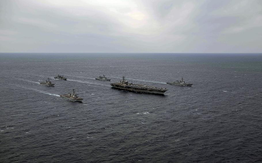 The aircraft carrier USS Nimitz sails with the destroyers USS Decatur and USS Wayne E. Meyer, along with South Korean warships, near the Korean Peninsula on March 27, 2023.