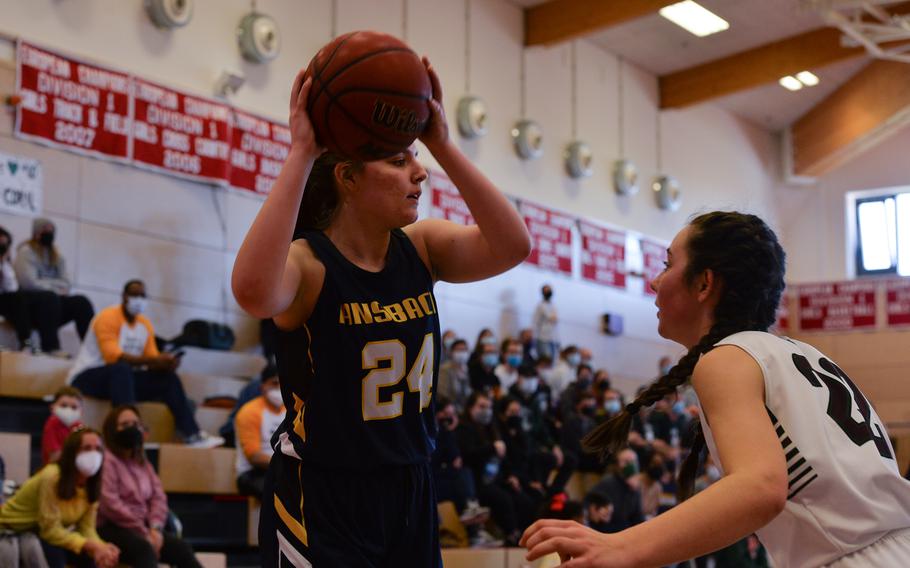 Ansbach’s Melanie Smith attempts to pass while AFNORTH’s Paula Bohlen plays defense during the DODEA-Europe Division III girls basketball title game in Kaiserslautern, Germany, on Saturday, Feb. 26, 2022.