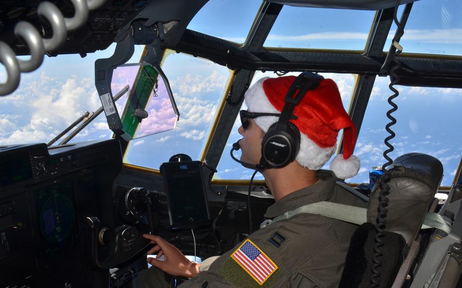 Capt. Ian Sweeney, an Operation Christmas Drop pilot, steers a C-130J Super Hercules from Guam to the Federated States of Micronesia, Dec. 5, 2023. He is assigned to the 36th Expeditionary Airlift Squadron at Yokota Air Base, Japan.