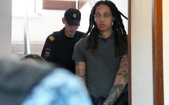 WNBA star and two-time Olympic gold medalist Brittney Griner is escorted to a courtroom for a hearing, in Khimki just outside Moscow, Russia, Monday, June 27, 2022. 