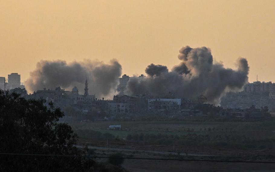 Smoke rises from buildings, viewed from the Israeli side of the border, as the Israeli military conducts a bombardment in northern Gaza on Oct. 15, 2023..