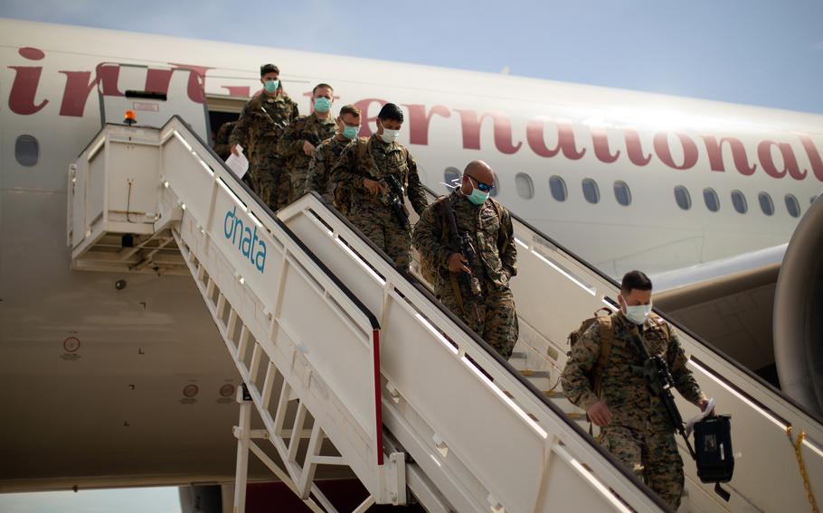 Marines with the Command Element, 5th Marine Regiment, Marine Rotational Force Darwin arrive at Royal Australian Air Force Base Darwin, Australia, March 12, 2022. 