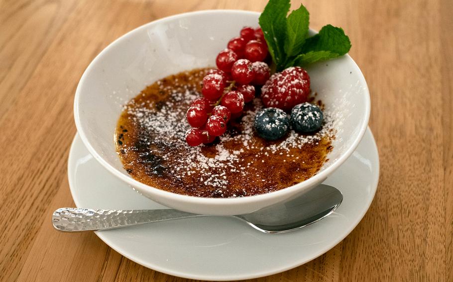 Creme brulee with mixed berries at the Steaklounge in Weiden, Germany, Aug. 16, 2022. 